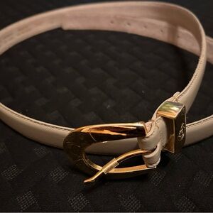 Elegant light beige belt with gold buckle
